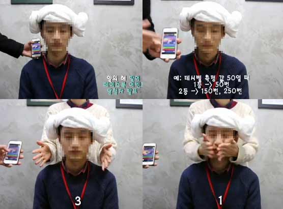 一位該公司職員坐著被一位女職員用雙手同時打兩側耳光，并用手機測噪音軟件測分貝數(視頻截圖)