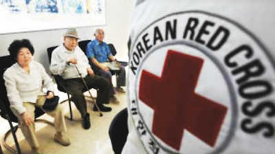 韓朝關系似將回暖申請者在等待韓國紅十字會宣布候選人名單。圖片來源：中新網